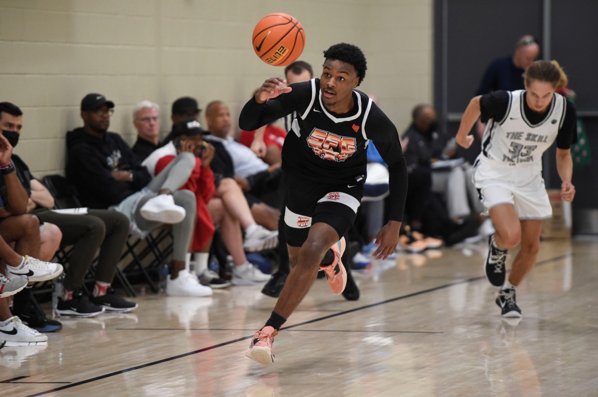Bronny James dribbles the ball.